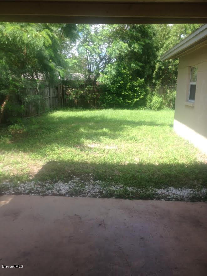 2216 Allan Adale Road Melbourne, FL 32935 - Photo 16 of 16 carport to side yard