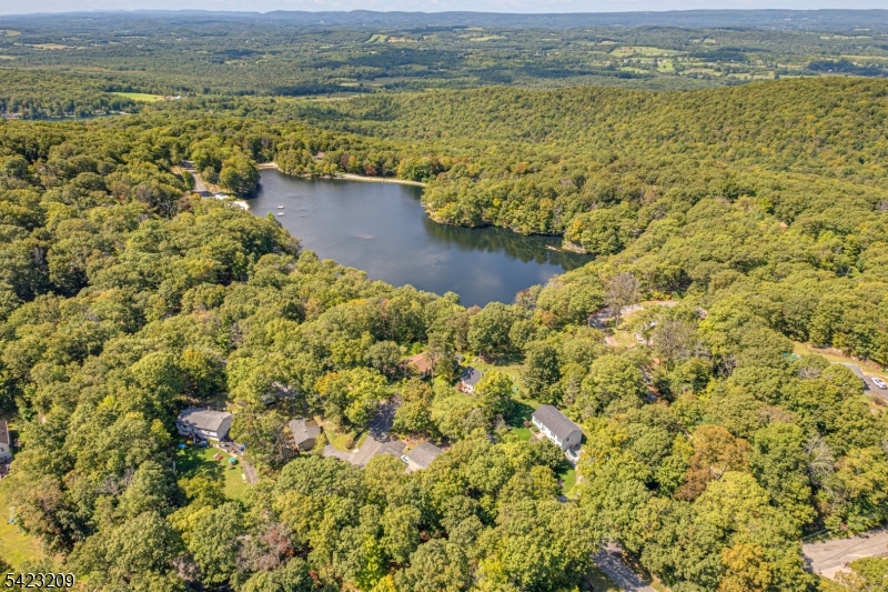 5 Split Rock Lane Vernon, NJ 07461 - Photo 4 of 8 a view of a lake with a mountain in the background