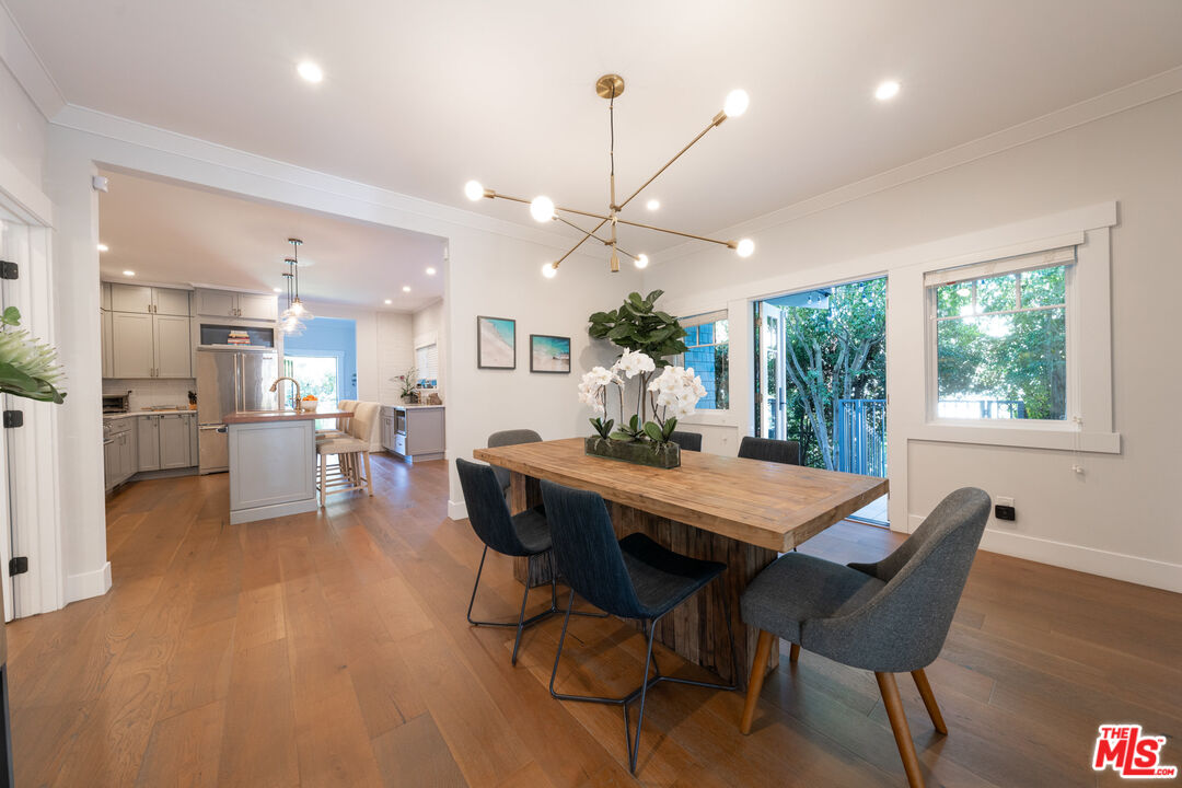 385 North Wilton Place Los Angeles, CA 90004 - Photo 11 of 53 a view of a dining room with furniture window and wooden floor