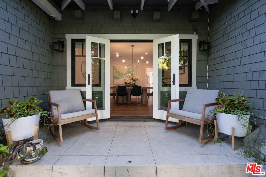 385 North Wilton Place Los Angeles, CA 90004 - Photo 13 of 53 a view of a patio with couple of chairs and a couch