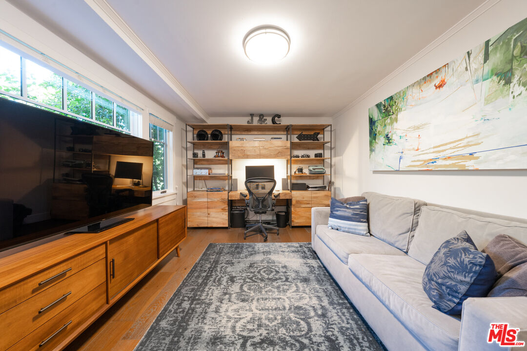 385 North Wilton Place Los Angeles, CA 90004 - Photo 21 of 53 a living room with furniture fireplace and flat screen tv