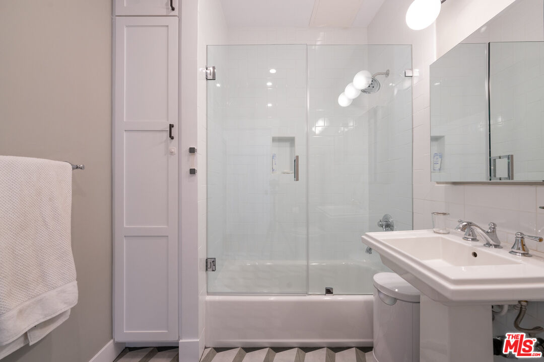 385 North Wilton Place Los Angeles, CA 90004 - Photo 23 of 53 a bathroom with a sink a toilet and shower