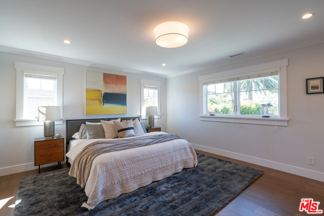 385 North Wilton Place Los Angeles, CA 90004 - Photo 32 of 53 a bedroom with a bed and a window