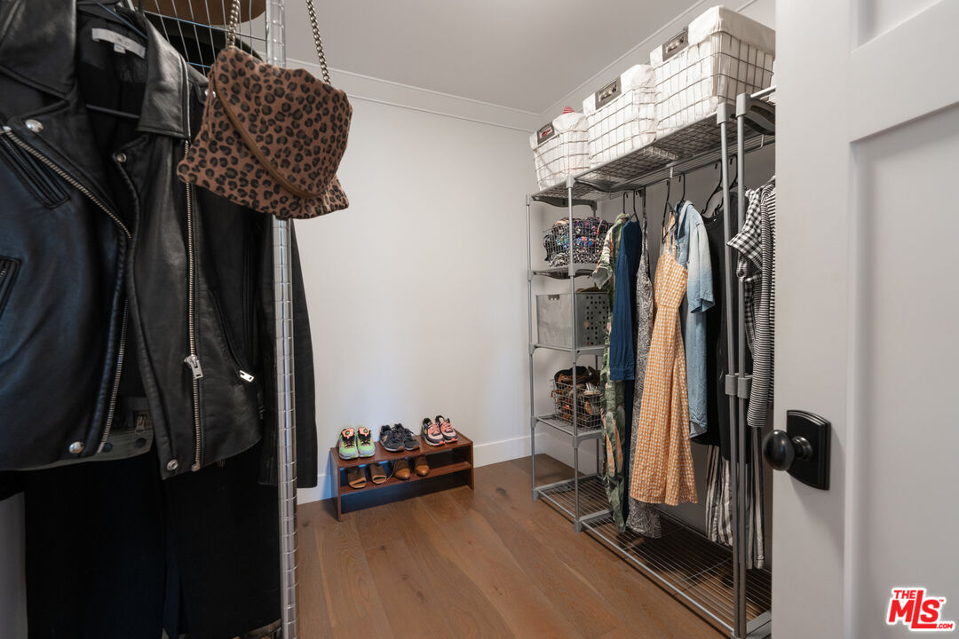 385 North Wilton Place Los Angeles, CA 90004 - Photo 37 of 53 a view of walk in closet with clothes and shoes