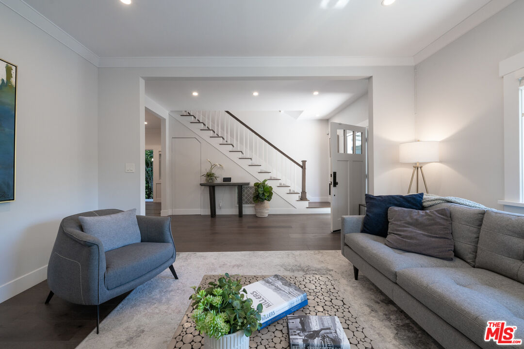 385 North Wilton Place Los Angeles, CA 90004 - Photo 8 of 53 a living room with furniture and wooden floor