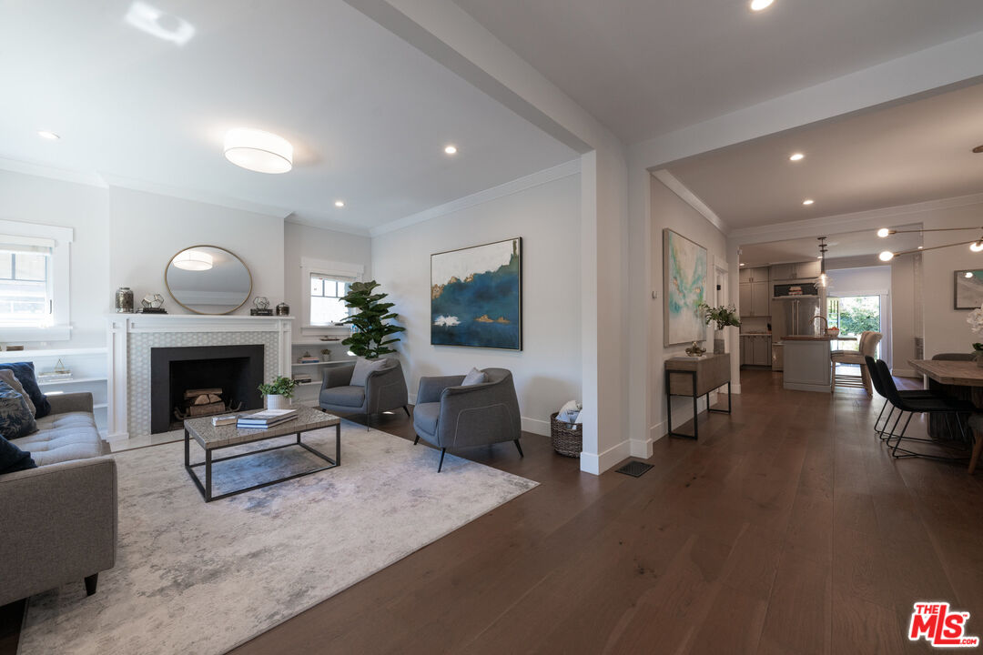 385 North Wilton Place Los Angeles, CA 90004 - Photo 10 of 53 a living room with furniture and a fireplace