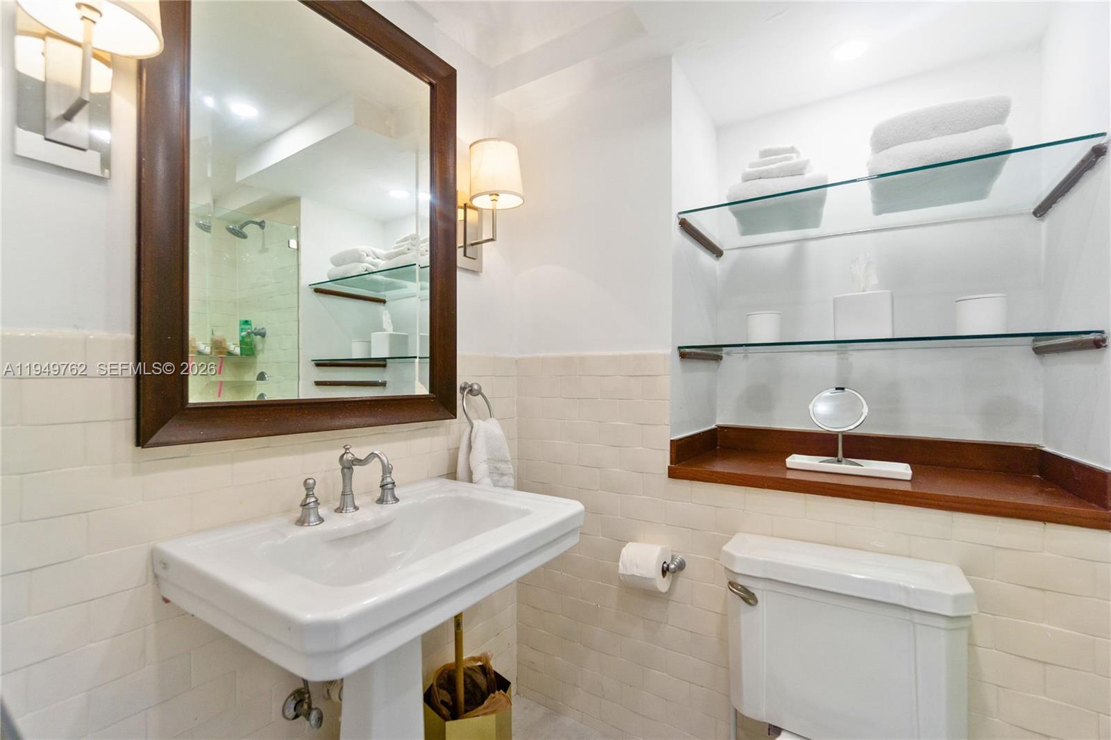 100 Lincoln Road, Unit 1447 Miami Beach, FL 33139 - Photo 15 of 39 a bathroom with a sink and a mirror