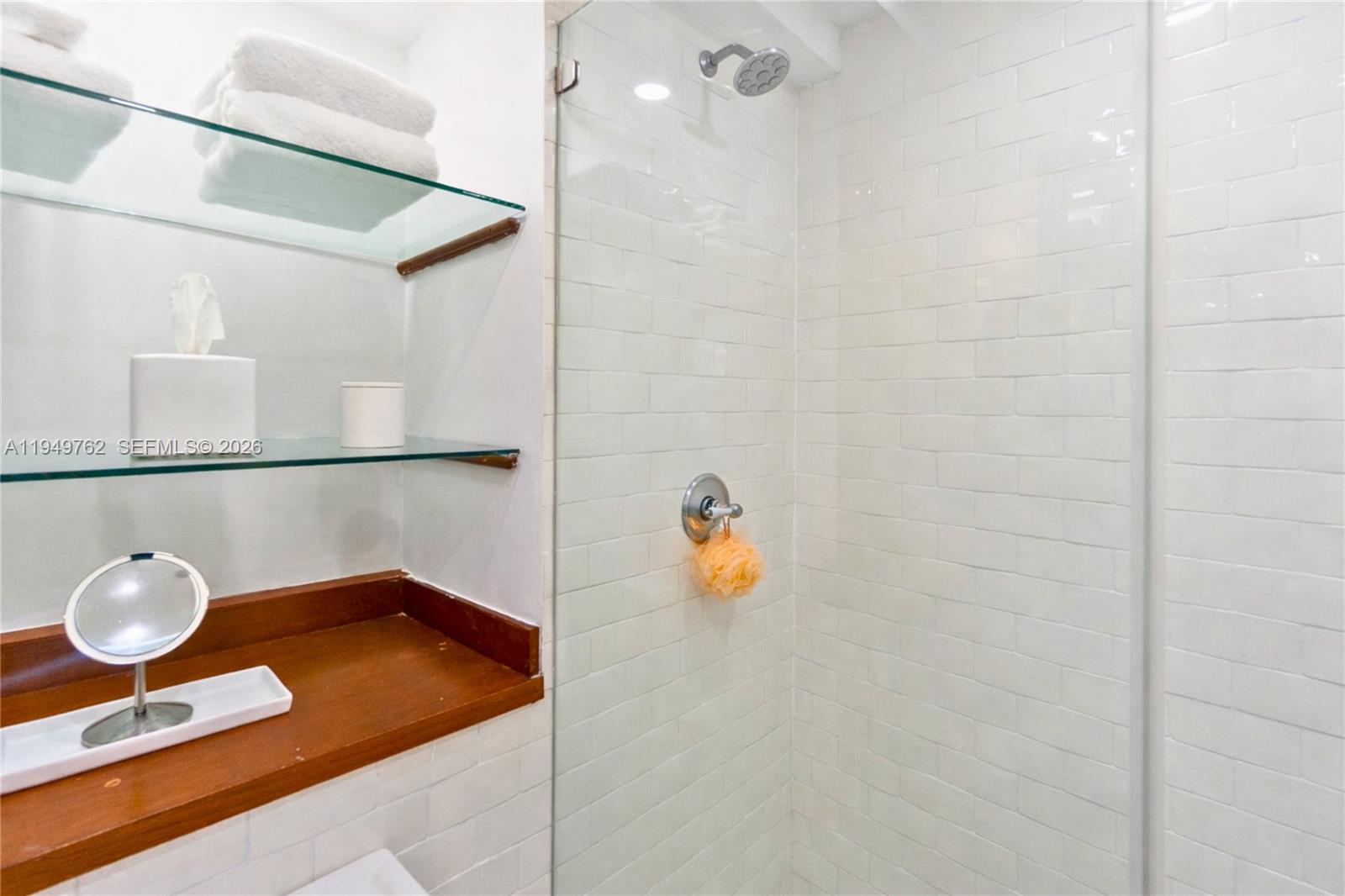 100 Lincoln Road, Unit 1447 Miami Beach, FL 33139 - Photo 17 of 39 a bathroom with a sink and a mirror