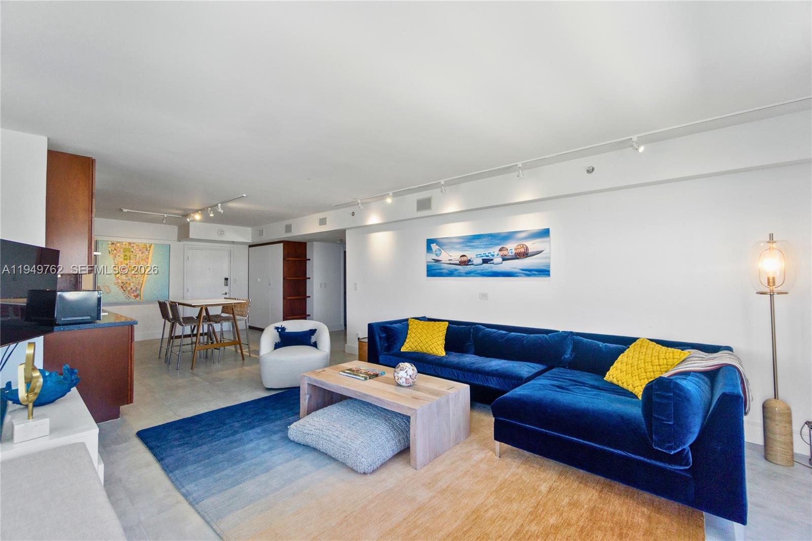 100 Lincoln Road, Unit 1447 Miami Beach, FL 33139 - Photo 2 of 39 a living room with furniture and a couch