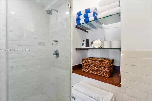 a bathroom with a shelf