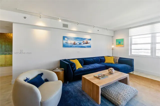 a living room with furniture and a window