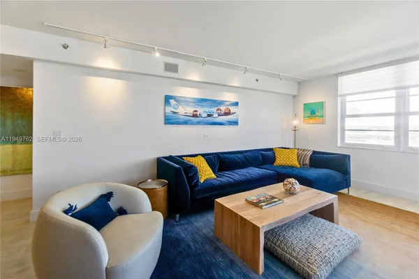 a living room with furniture and a window