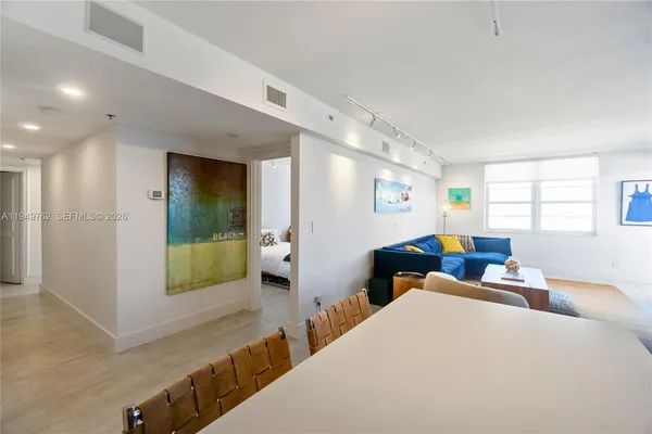 a living room with furniture and a table