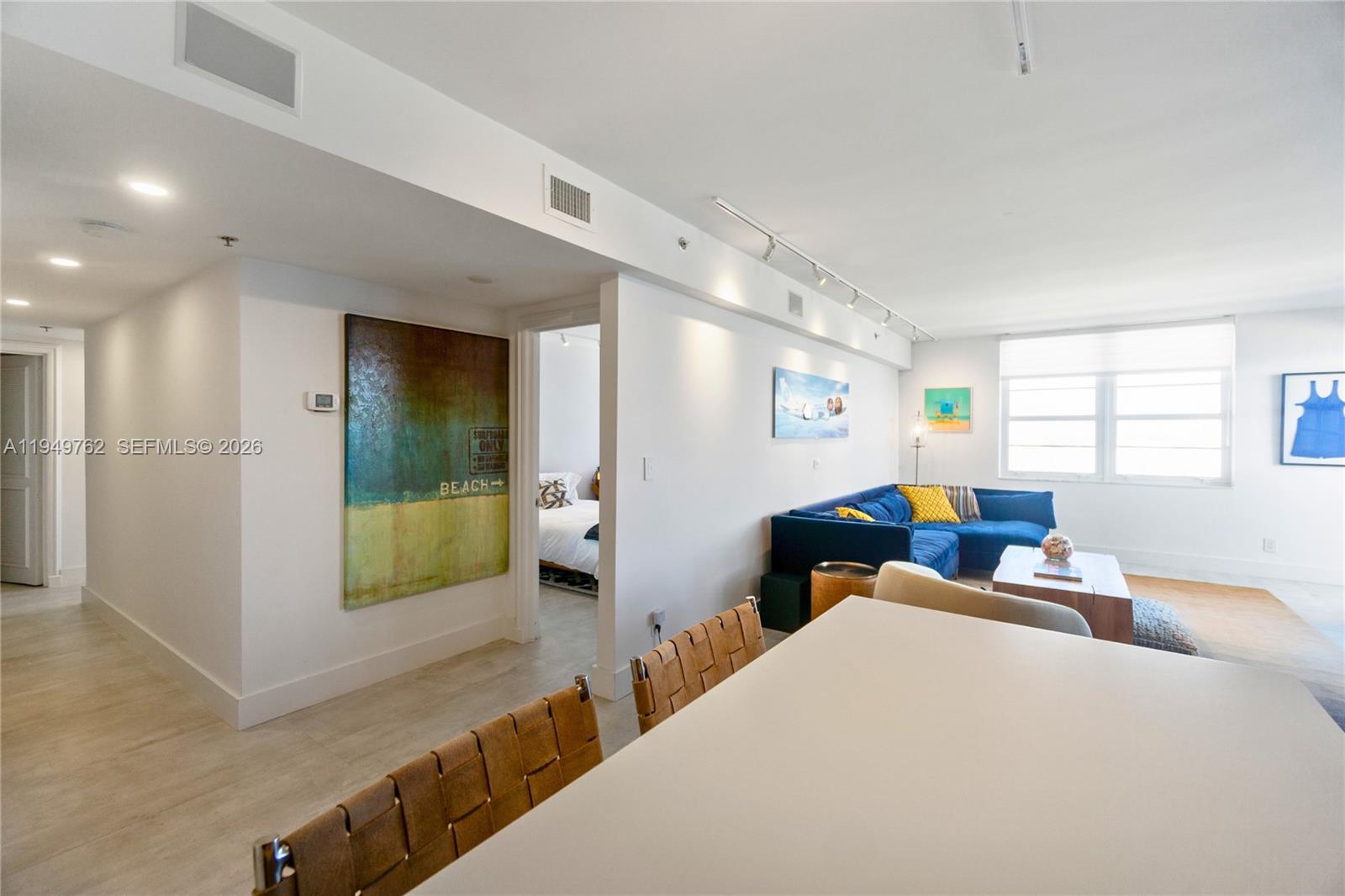 100 Lincoln Road, Unit 1447 Miami Beach, FL 33139 - Photo 10 of 39 a living room with furniture and a table