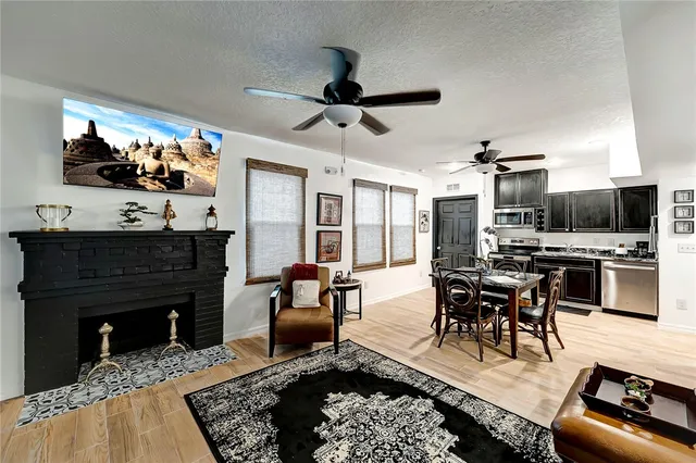 a living room with furniture and a fireplace
