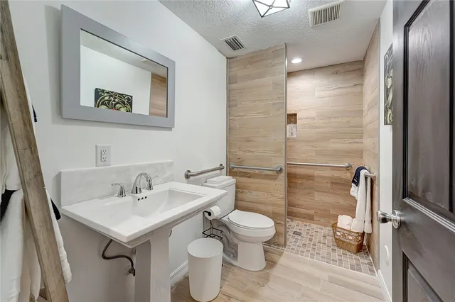 a bedroom with a bed and a mirror