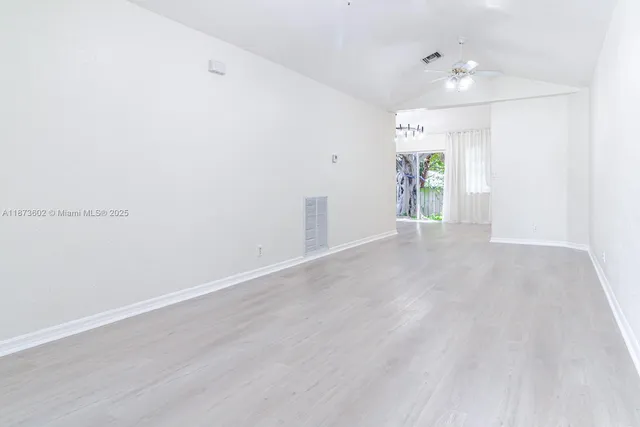 a view of an empty room and window