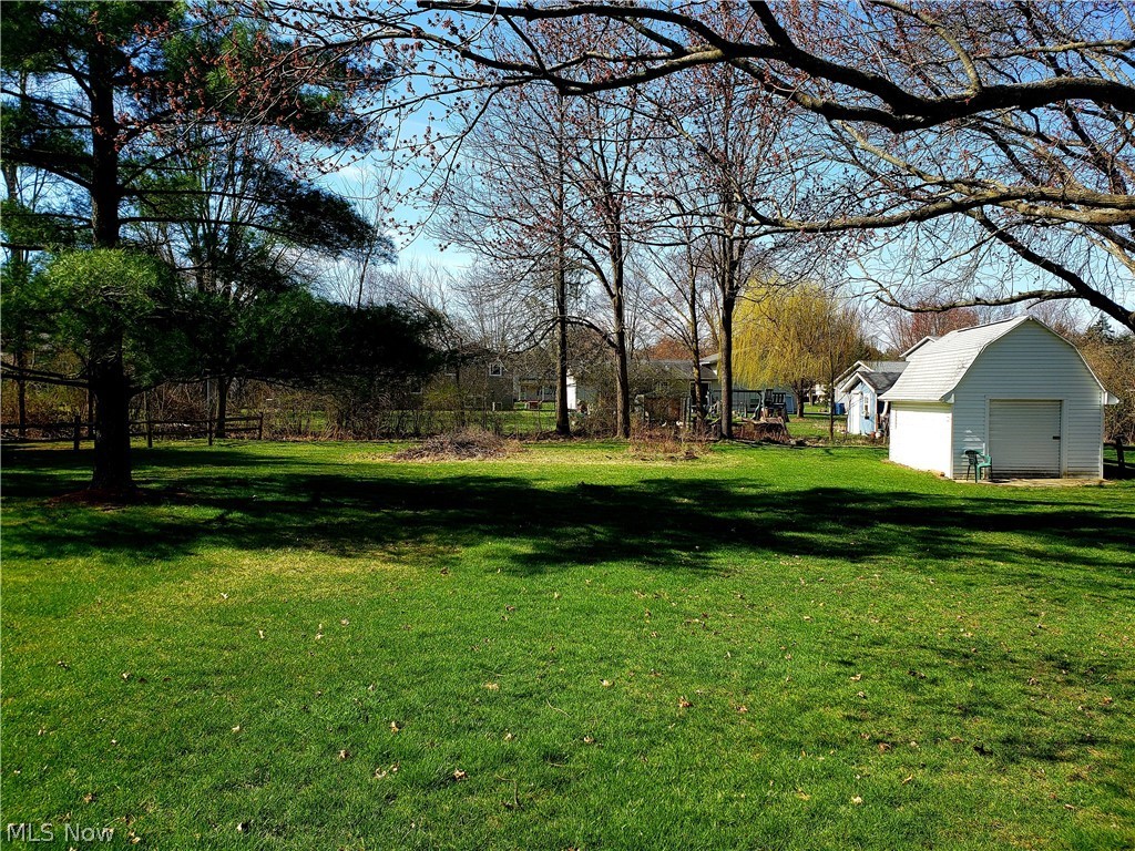 8644 Root Road North Ridgeville, OH 44039 - Photo 6 of 32 View of yard with a garage and an outdoor structure