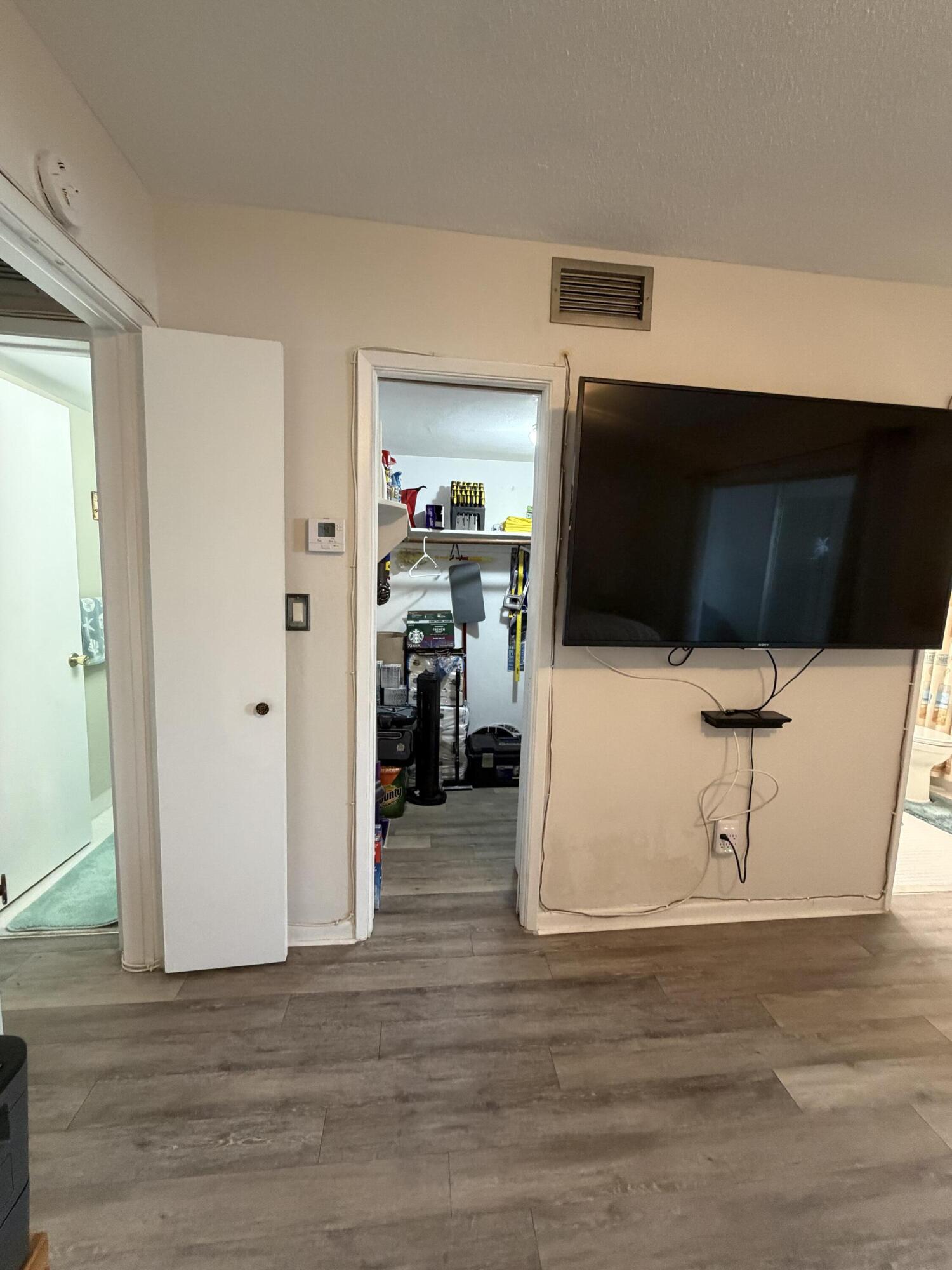 2050 Northeast 39th Street, Unit S103 Lighthouse Point, FL 33064 - Photo 15 of 46 a view of a livingroom with wooden floor