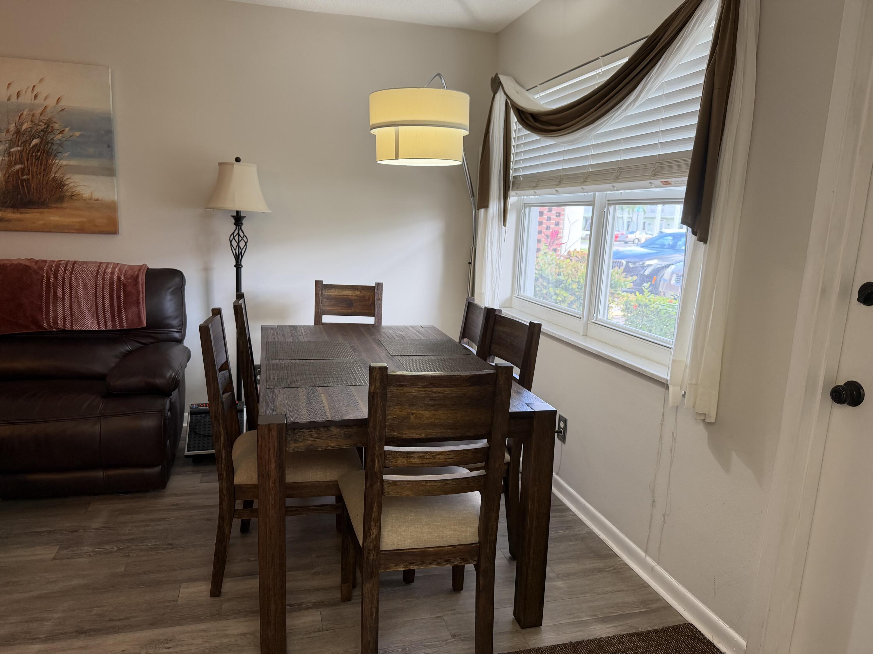 2050 Northeast 39th Street, Unit S103 Lighthouse Point, FL 33064 - Photo 3 of 46 a view of a workspace with furniture and a window