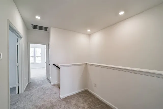 a kitchen with a sink and large window