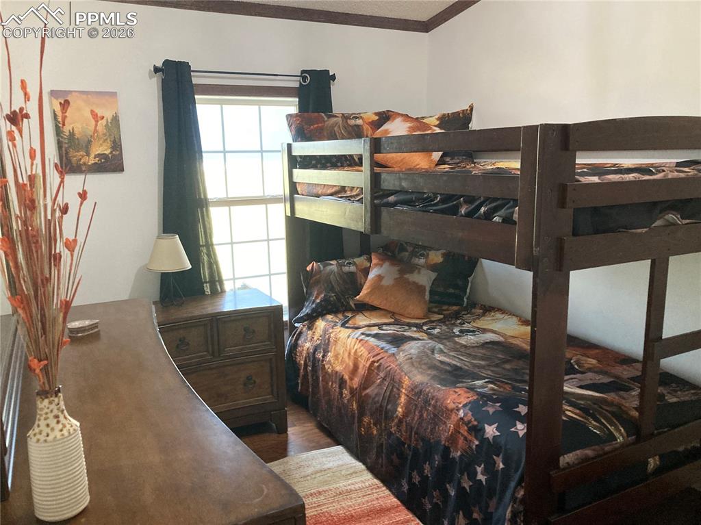 136 Black Knat Road Fairplay, CO 80440 - Photo 19 of 38 a bed sitting in a bedroom next to a window