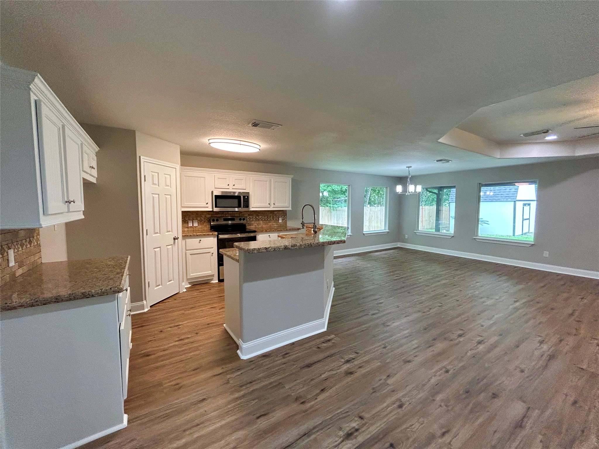 7902 Masters Manvel, TX 77578 - Photo 20 of 21 The floor plan flows beautifully between the ISLAND KITCHEN, dining area and den.