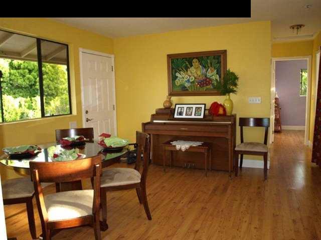 299 Awalau Road Haiku, HI 96708 - Photo 11 of 12 a living room with furniture and a wooden floor