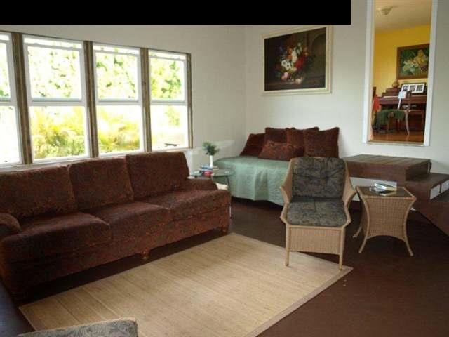 299 Awalau Road Haiku, HI 96708 - Photo 6 of 12 a living room with furniture and a large window