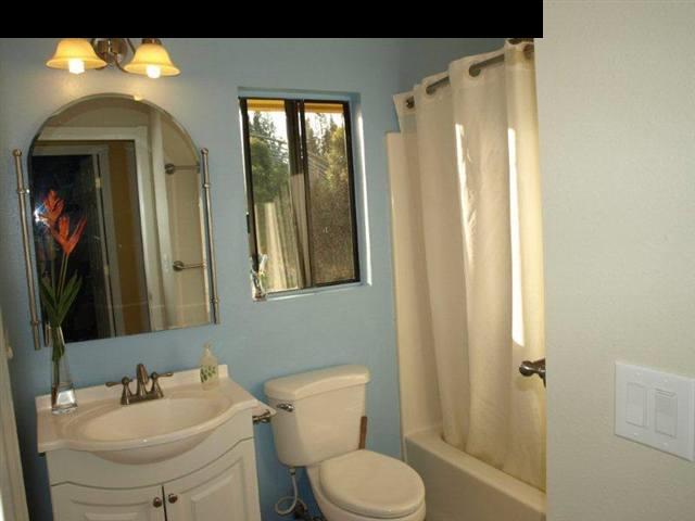 299 Awalau Road Haiku, HI 96708 - Photo 8 of 12 a bathroom with a toilet sink and mirror