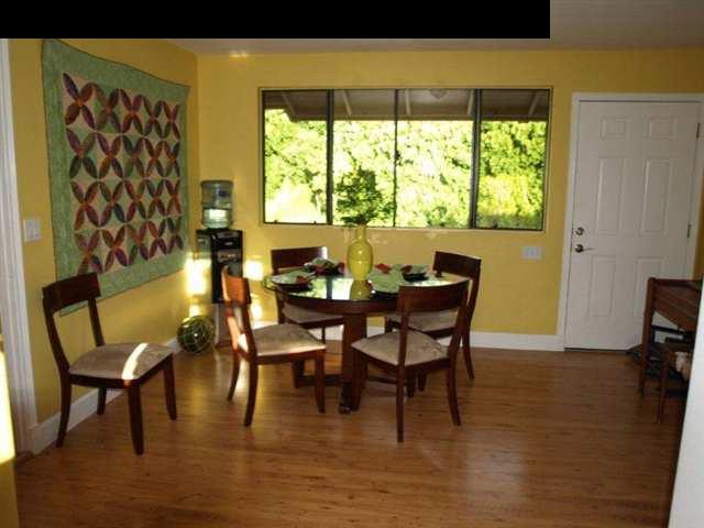 299 Awalau Road Haiku, HI 96708 - Photo 9 of 12 a dining room with furniture and wooden floor