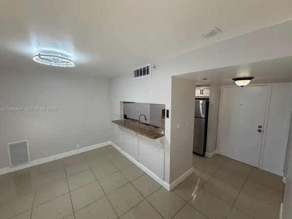 a view of a kitchen cabinets and utility room