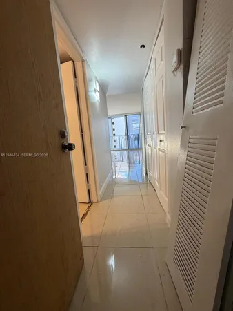 a view of an empty room with stairs