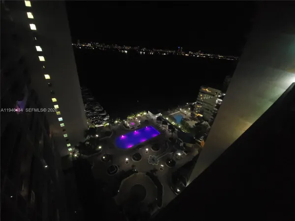 a view of a house with a porch and furniture