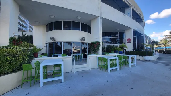 a room with lots of furniture and potted plants