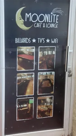 a bathroom with a glass door shower and a sink