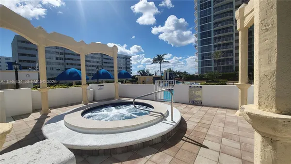 a view of a swimming pool with a patio