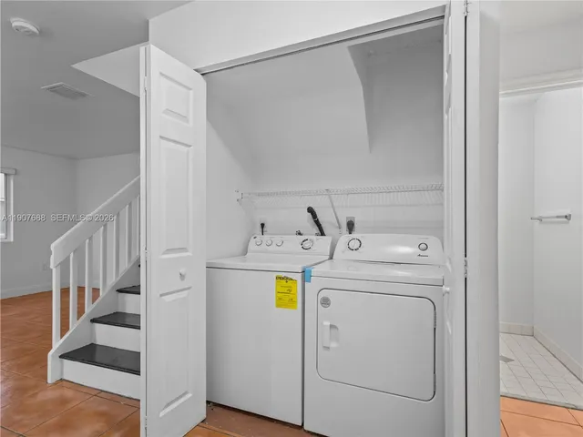 a utility room with dryer and washer