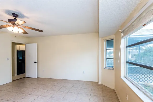 a spacious bathroom with a granite countertop sink a mirror and a
