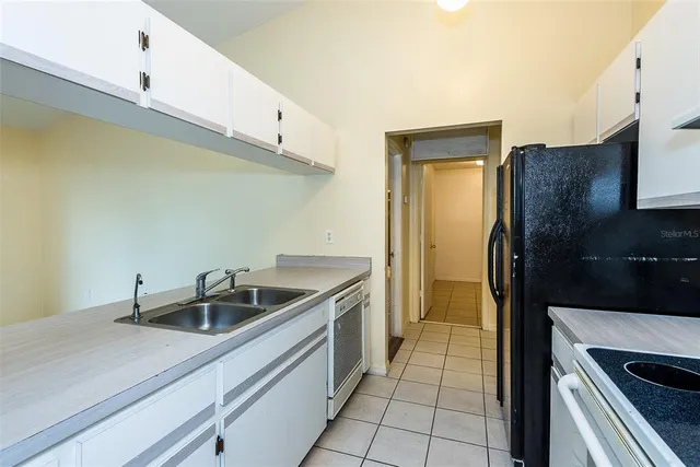 a kitchen with a stove and a refrigerator