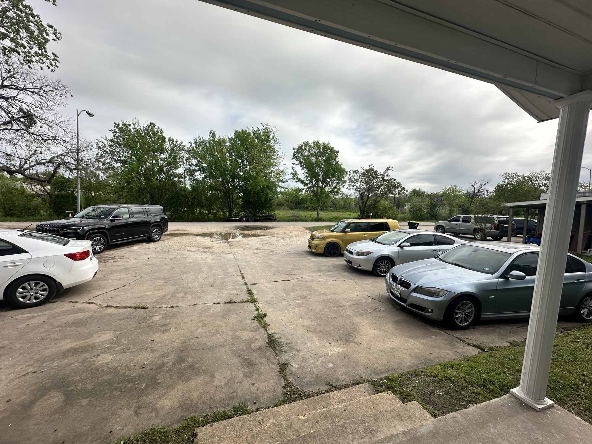 607 Reed Avenue Wharton, TX 77488 - Photo 9 of 13 a view of parking with cars parked
