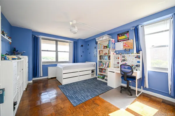 a bedroom with furniture and a window