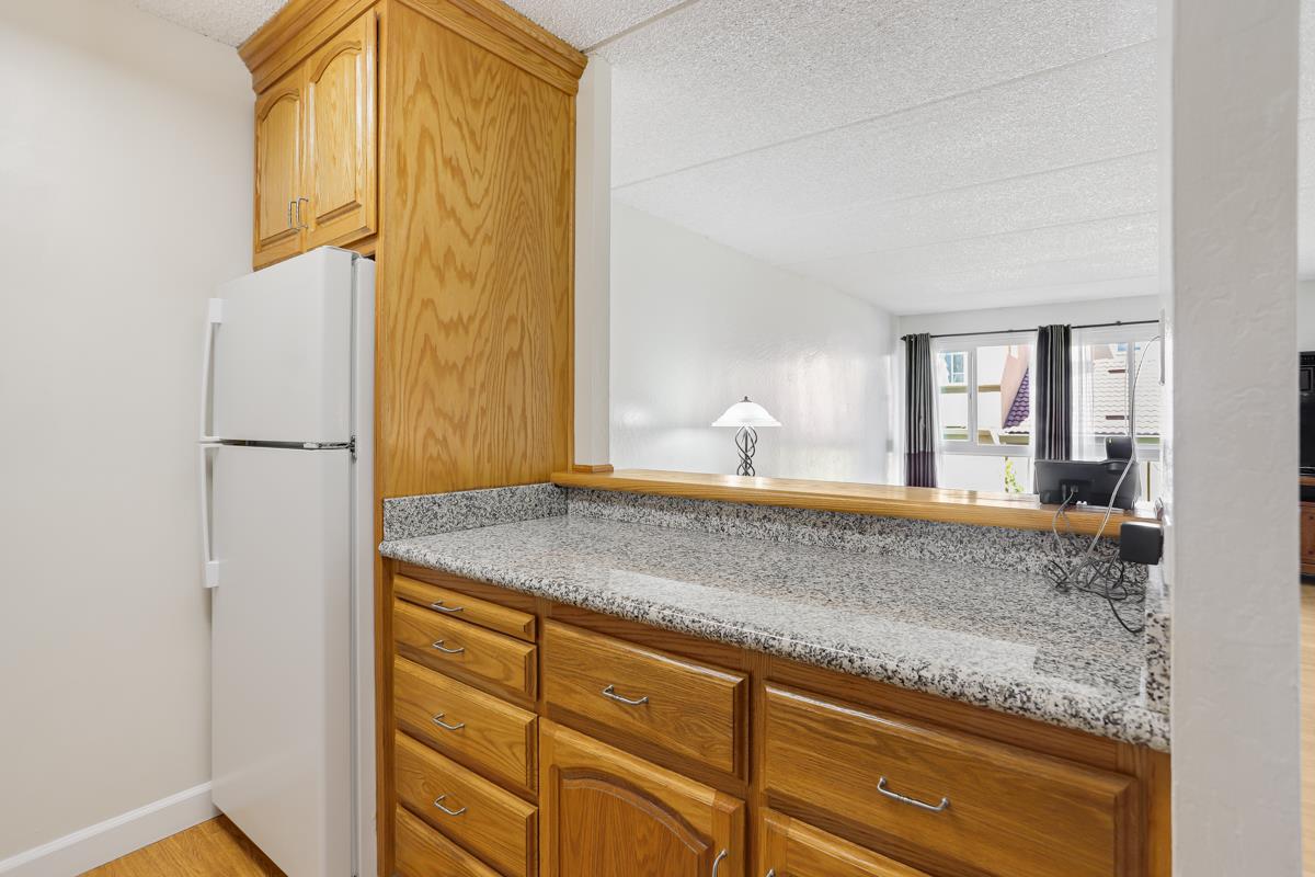 1700 Civic Center Drive, Unit 214 Santa Clara, CA 95050 - Photo 8 of 17 a bathroom with a granite countertop sink and a mirror