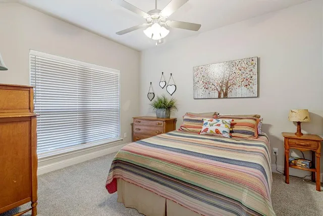 a bedroom with furniture and a window