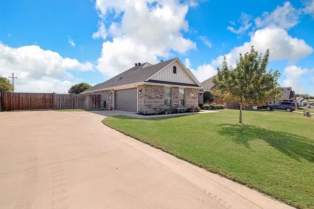 a view of house with a garden