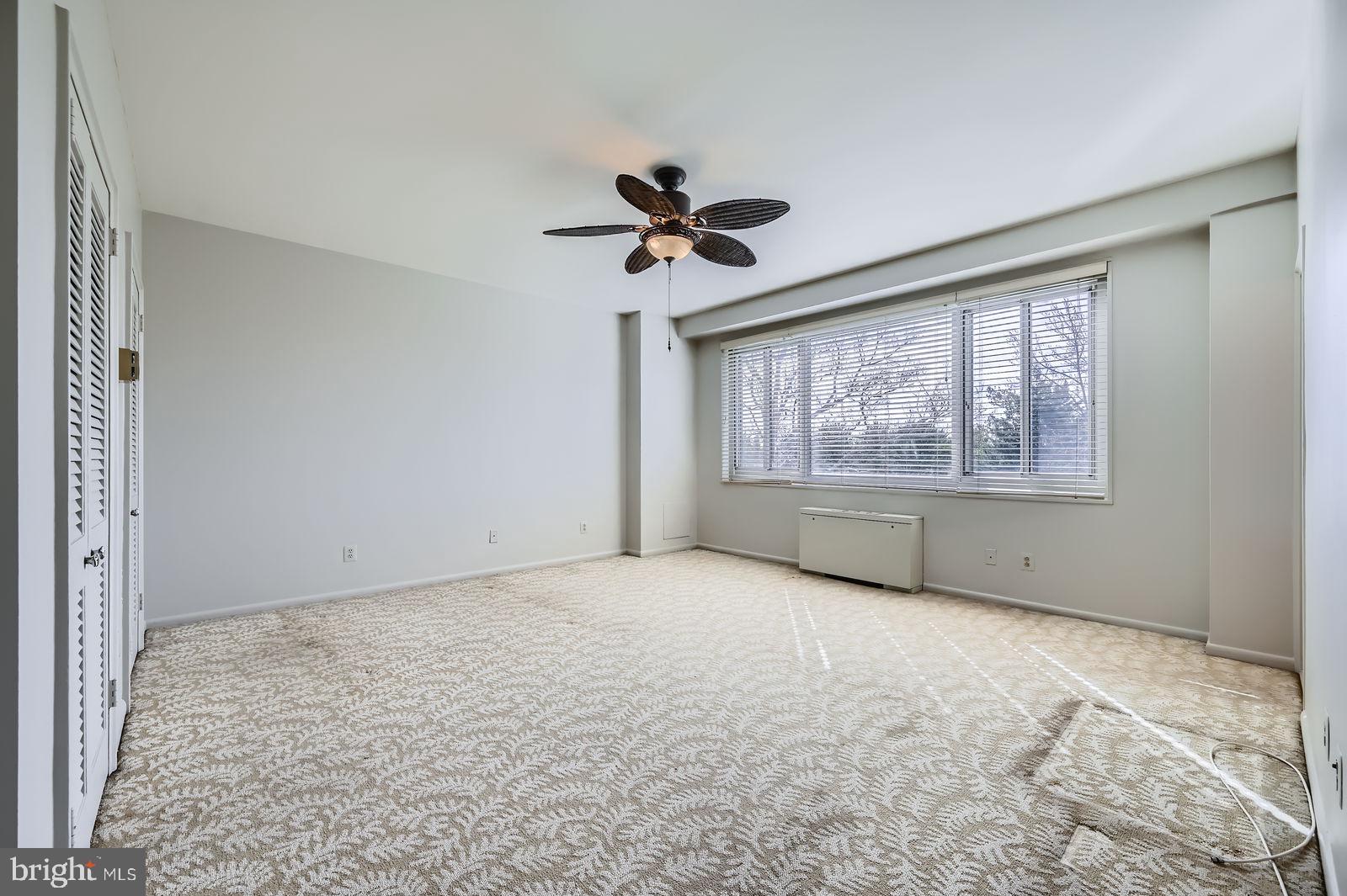11 Slade Avenue, Unit 509 Baltimore, MD 21208 - Photo 13 of 30 a view of an empty room with a window