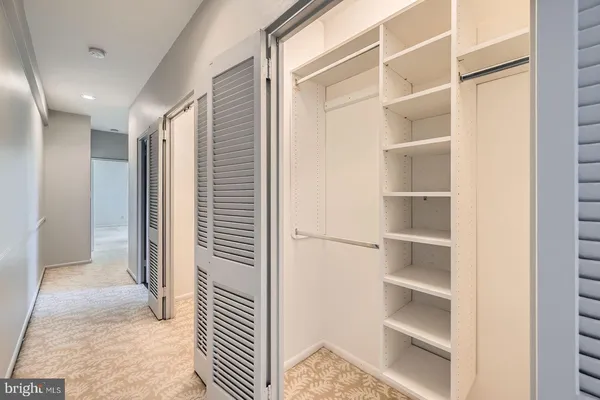 a view of a hallway with closet