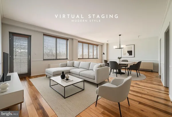 a living room with furniture wooden floor and a table