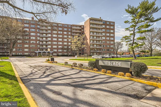 a view of swimming pool with outdoor seating and plants
