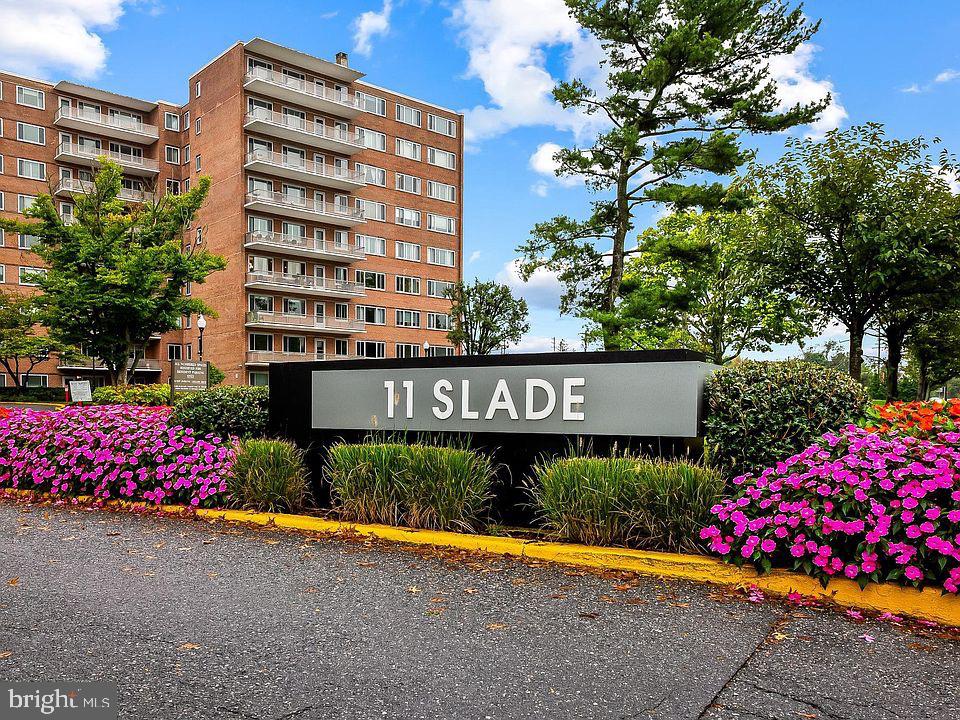 11 Slade Avenue, Unit 509 Baltimore, MD 21208 - Photo 3 of 30 a view of sign board with flower plants